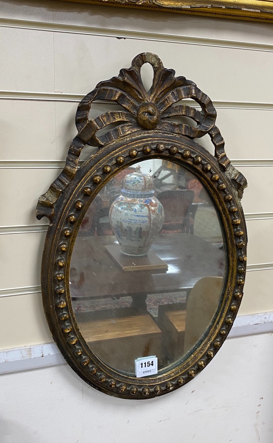 A 19th century giltwood and gesso oval wall mirror, height 59cm